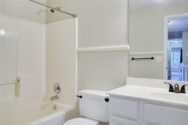 full bathroom featuring shower / tub combination, vanity, and toilet