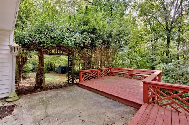 wooden terrace featuring a patio area