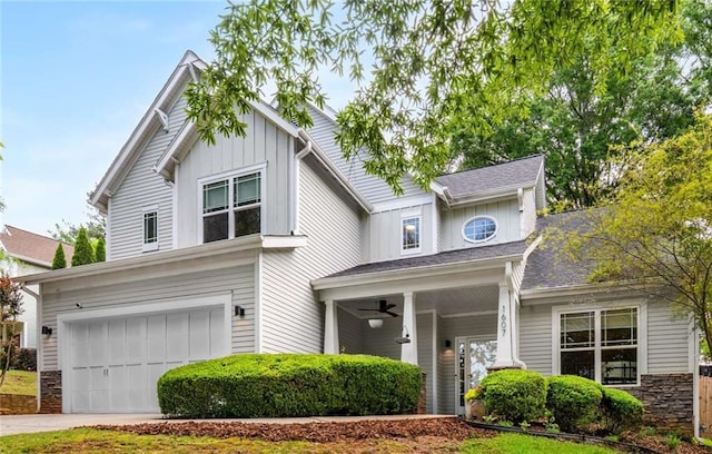 1607 Boulder Walk Dr SE, Atlanta, GA 30316 - view of front of house with a garage, board and batten siding, a ceiling fan, stone siding, and driveway