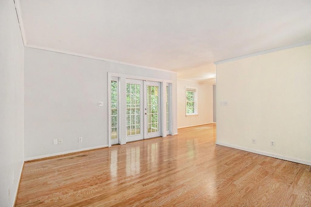 1445 Monroe Dr NE Unit F10, Atlanta, GA 30324 - spare room with wood finished floors, crown molding, and baseboards
