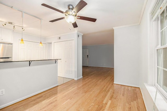 1445 Monroe Dr NE Unit F10, Atlanta, GA 30324 - unfurnished room featuring ornamental molding, a ceiling fan, light wood-style flooring, and baseboards