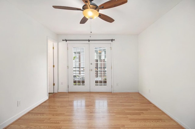 1445 Monroe Dr NE Unit F10, Atlanta, GA 30324 - spare room with french doors, baseboards, and light wood-type flooring