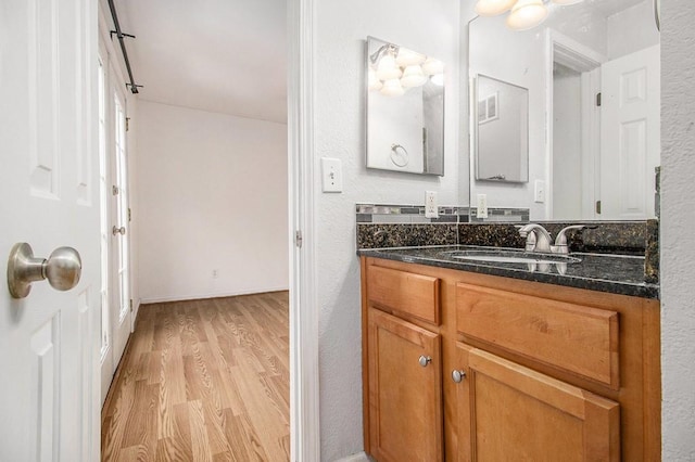 1445 Monroe Dr NE Unit F10, Atlanta, GA 30324 - bathroom with wood finished floors and vanity