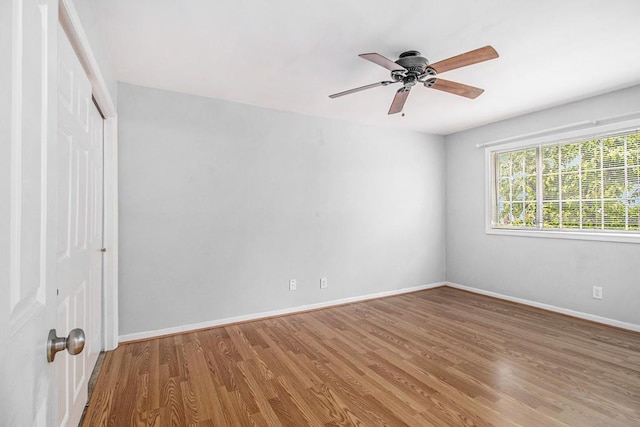 1445 Monroe Dr NE Unit F10, Atlanta, GA 30324 - unfurnished room with wood finished floors, baseboards, and ceiling fan