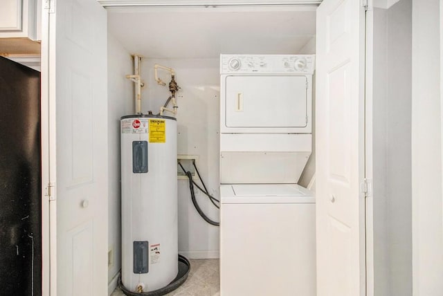1445 Monroe Dr NE Unit F10, Atlanta, GA 30324 - laundry room featuring electric water heater, stacked washer / drying machine, and light tile patterned floors