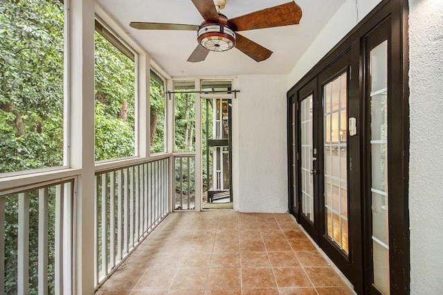 1445 Monroe Dr NE Unit F10, Atlanta, GA 30324 - unfurnished sunroom featuring a textured wall, french doors, tile patterned flooring, and plenty of natural light
