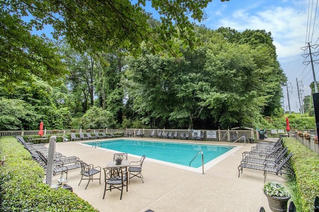 1445 Monroe Dr NE Unit F10, Atlanta, GA 30324 - community pool featuring a patio
