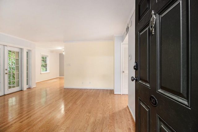 1445 Monroe Dr NE Unit F10, Atlanta, GA 30324 - unfurnished room featuring crown molding, light wood-type flooring, and baseboards