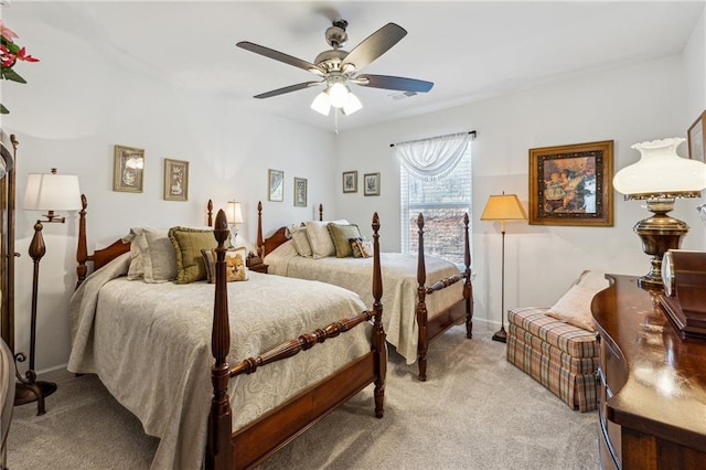 bedroom with ceiling fan and light colored carpet