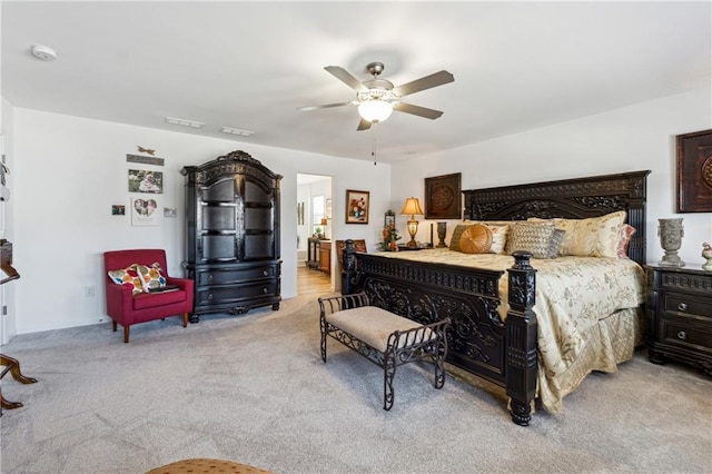 bedroom featuring light carpet, ceiling fan, and visible vents