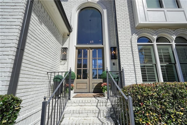 entrance to property with brick siding