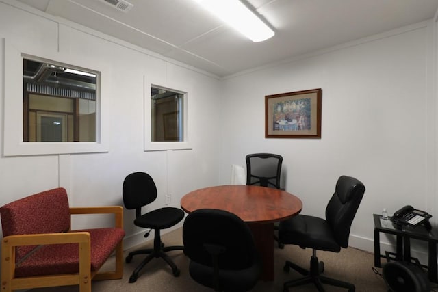 office with ornamental molding and carpet