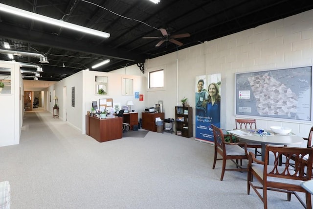 carpeted office with ceiling fan