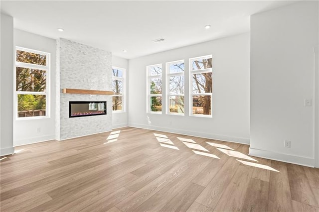 490 Hammons Way, Atlanta, GA 30315 - unfurnished living room with light wood finished floors, a fireplace, and recessed lighting