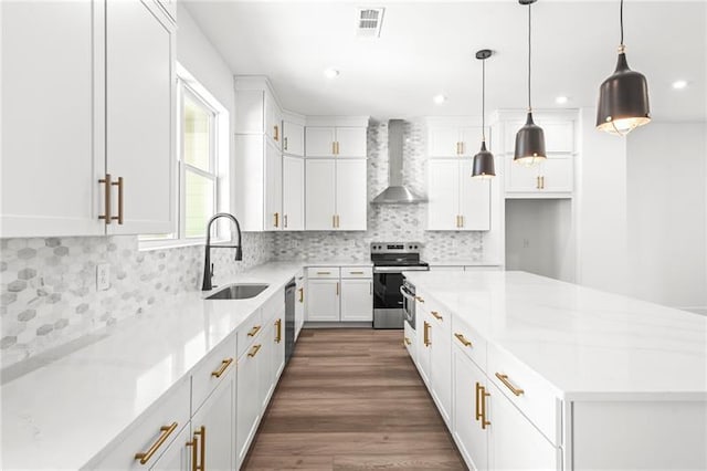 490 Hammons Way, Atlanta, GA 30315 - kitchen with wall chimney range hood, stainless steel appliances, white cabinets, and recessed lighting