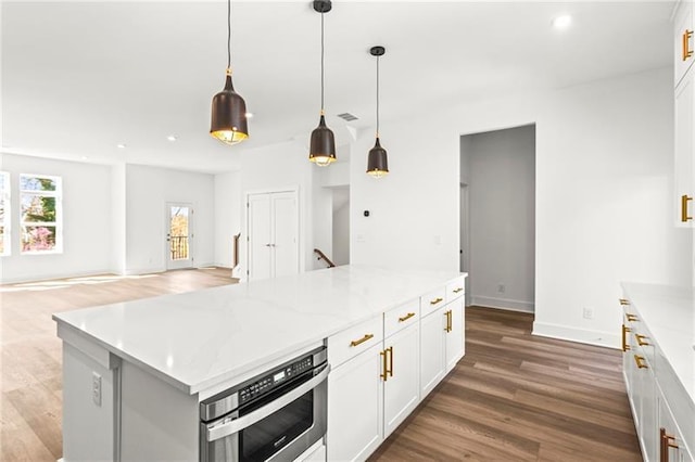 490 Hammons Way, Atlanta, GA 30315 - kitchen featuring recessed lighting, wood finished floors, white cabinets, pendant lighting, and open floor plan