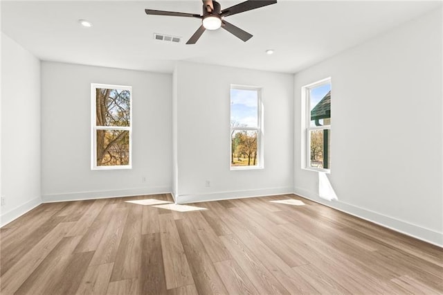 490 Hammons Way, Atlanta, GA 30315 - empty room with healthy amount of natural light, light wood-type flooring, recessed lighting, and ceiling fan