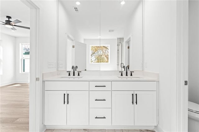 490 Hammons Way, Atlanta, GA 30315 - full bath with double vanity, ceiling fan, plenty of natural light, wood finished floors, and recessed lighting