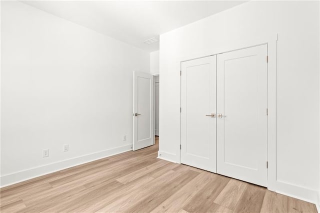 490 Hammons Way, Atlanta, GA 30315 - unfurnished bedroom featuring light wood finished floors and a closet