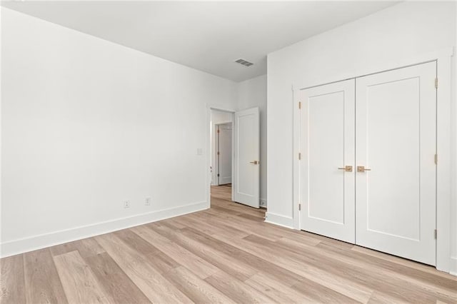 490 Hammons Way, Atlanta, GA 30315 - unfurnished bedroom with light wood finished floors and a closet