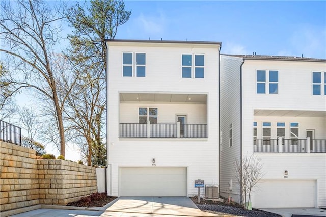 490 Hammons Way, Atlanta, GA 30315 - view of front of home with a garage, concrete driveway, and a balcony