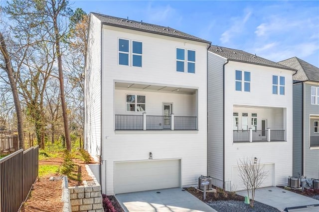 490 Hammons Way, Atlanta, GA 30315 - view of property with an attached garage, concrete driveway, and a balcony