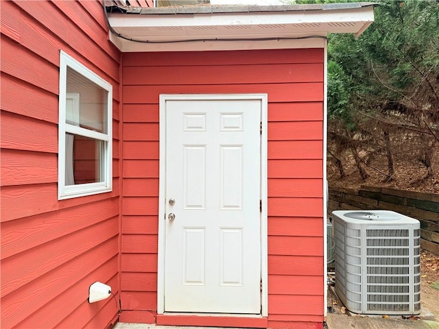 doorway to property featuring central AC unit