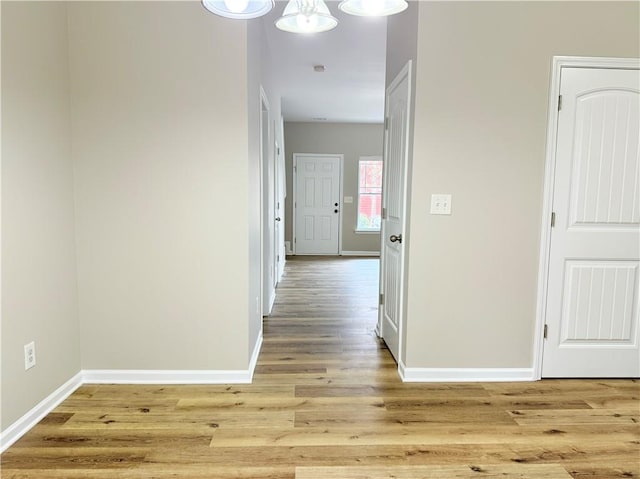 hallway featuring wood-type flooring