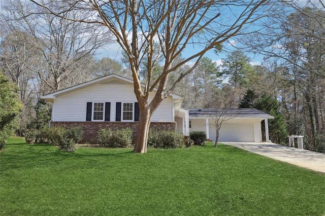 view of front of home with a front yard and a garage