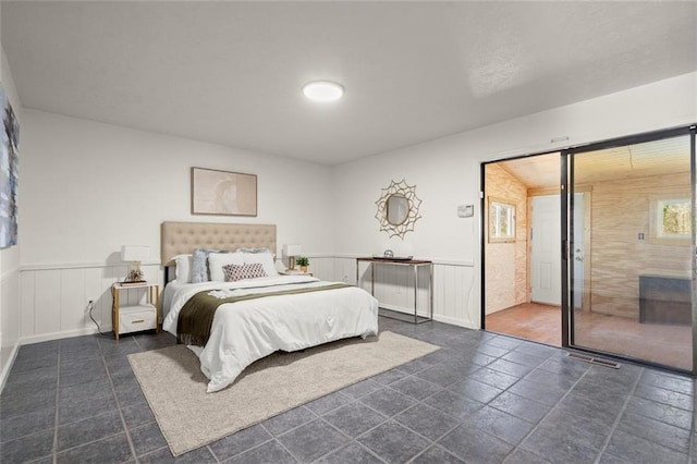 bedroom with a wainscoted wall