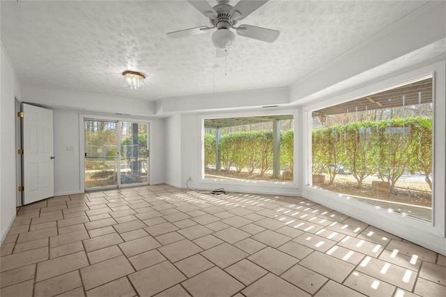 unfurnished sunroom with a ceiling fan