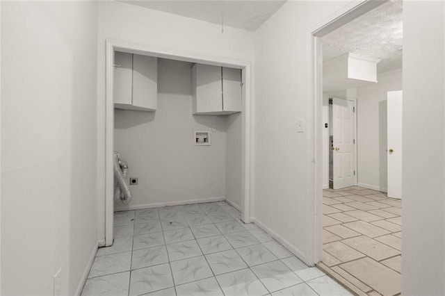 laundry room featuring washer hookup, cabinet space, hookup for an electric dryer, a textured ceiling, and baseboards