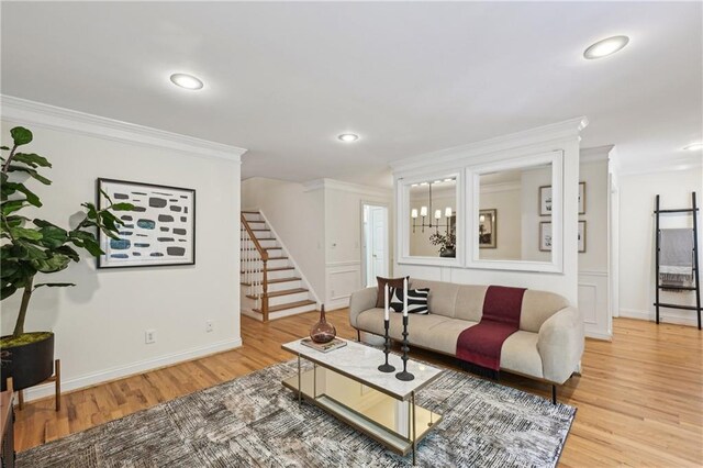 1634 Ponce De Leon Ave NE Unit 514, Atlanta, GA 30307 - living room with light wood finished floors, crown molding, stairs, and recessed lighting