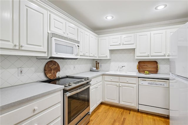 1634 Ponce De Leon Ave NE Unit 514, Atlanta, GA 30307 - kitchen featuring white appliances, light countertops, white cabinetry, and recessed lighting