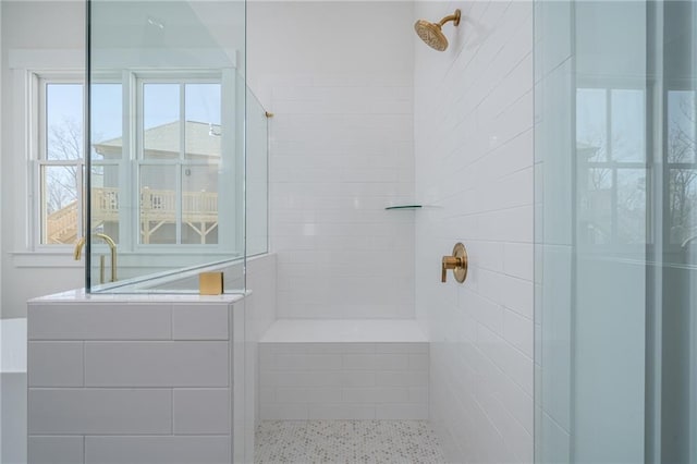 bathroom with tiled shower
