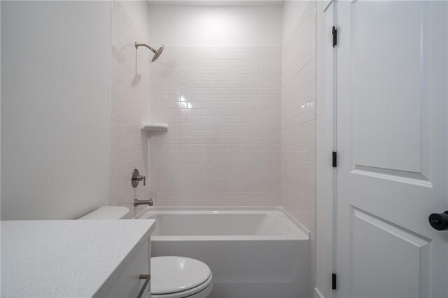 full bath featuring bathtub / shower combination, vanity, and toilet