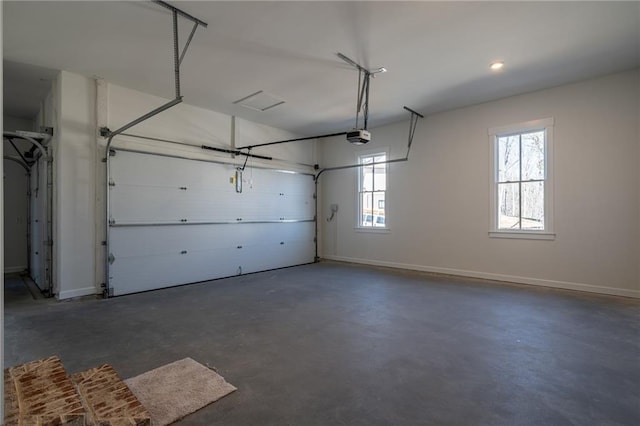 garage with a garage door opener and baseboards