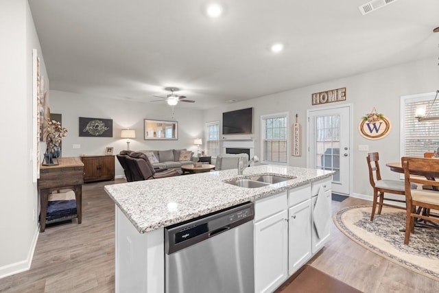2046 Westbrook Rd, Commerce, GA 30530 - kitchen featuring dishwasher, a sink, a ceiling fan, light wood-type flooring, and white cabinets