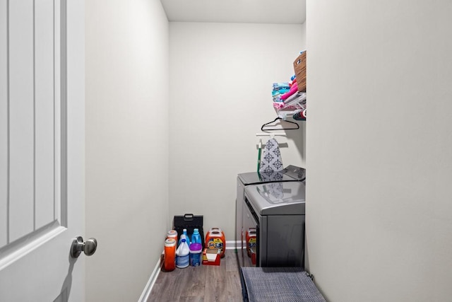 2046 Westbrook Rd, Commerce, GA 30530 - washroom featuring washer and clothes dryer, wood finished floors, and baseboards