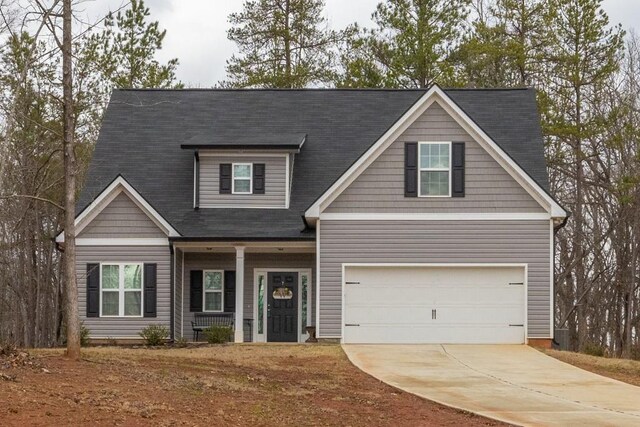 2046 Westbrook Rd, Commerce, GA 30530 - craftsman-style house featuring driveway, a garage, and a porch