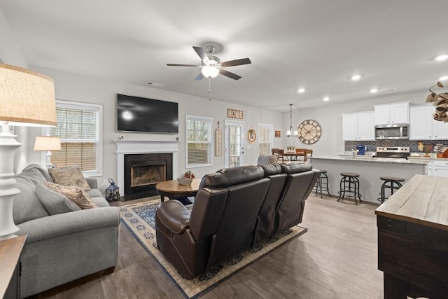 2046 Westbrook Rd, Commerce, GA 30530 - living room with a fireplace with flush hearth, ceiling fan, wood finished floors, and recessed lighting