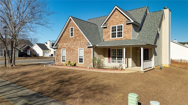 view of front of home with a front lawn and a porch