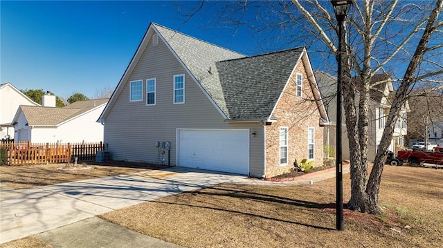 view of side of home with a garage