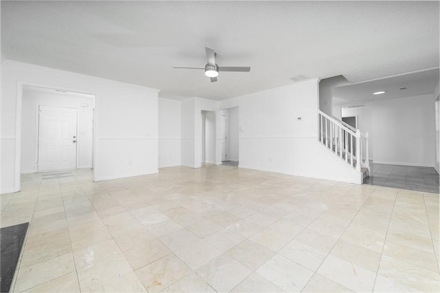 unfurnished living room with ceiling fan