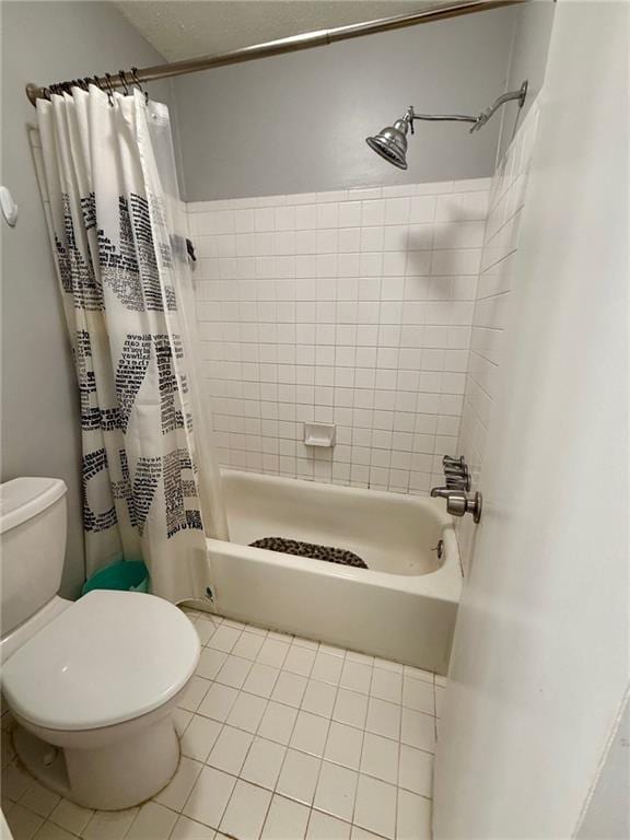 bathroom featuring shower / bath combo, toilet, and tile patterned floors