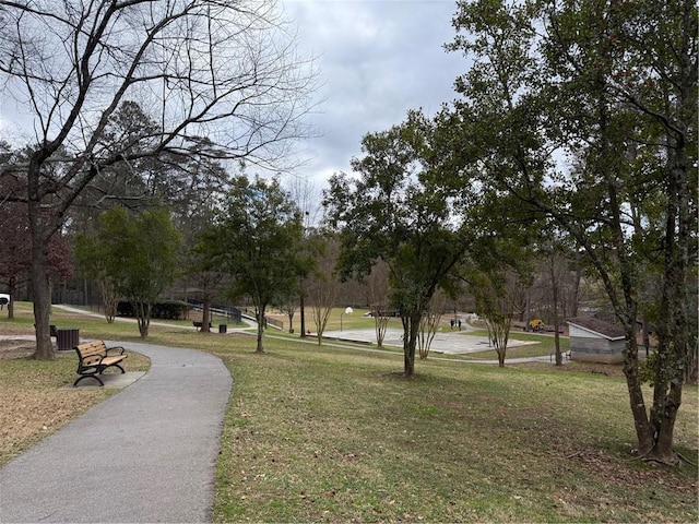 view of property's community with a lawn