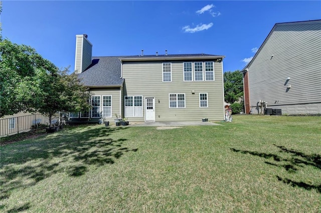 rear view of house featuring a chimney, a patio, and cooling unit