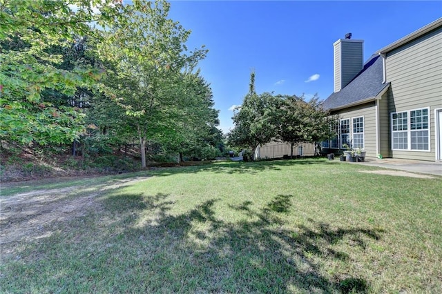 view of grassy yard featuring a patio