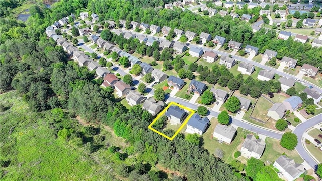 aerial overview of property's location with property boundaries highlighted and nearby suburban area