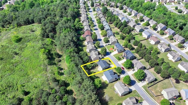 aerial view of property's location featuring nearby suburban area and property parcel outlined